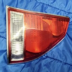 Right rear passenger side tail light assembly for 2000-2003 Mitsubishi Diamante with Stanley P1017 stamping.