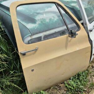Driver side door shell for a 1973–1987 Chevy or GMC Square Body truck, tan finish, manual windows, includes glass, features speaker hole modification, door panel excluded