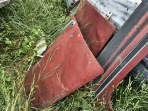 Pair of red 1973–1987 Chevy or GMC Square Body truck doors with body damage, sold for internal parts use only