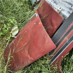 Pair of red 1973–1987 Chevy or GMC Square Body truck doors with body damage, sold for internal parts use only
