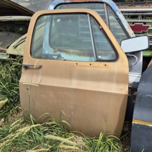 Passenger side door for a 1973–1987 Chevy or GMC Square Body truck, tan finish, manual window setup,