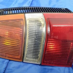 Front lens view of vintage OEM Nissan Sentra Sunny B11 right passenger side tail light assembly by Koito.