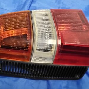 Front view of a vintage OEM 1982-1986 Nissan Sentra Sunny B11 left driver side tail light assembly.