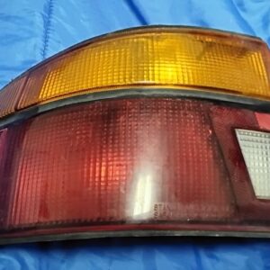 Used Left Driver Side Tail Light for 1991-1996 Ford Escort Hatchback