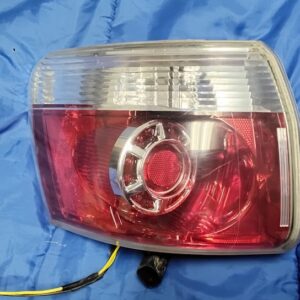 OEM 2007-2012 GMC Acadia driver side left tail light assembly front lens view