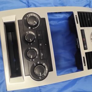 Full front overview of OEM 2008-2010 Chrysler 300 silver center dash bezel and climate controls