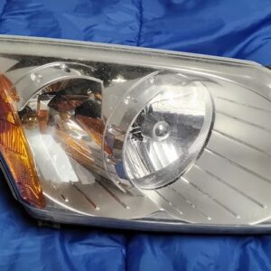 Restore front-end visibility and original appearance on your vehicle with this original OEM driver side (left / LH) headlight assembly. Engineered specifically for 2007–2012 Dodge Caliber models, this headlight is manufactured by factory supplier DECOMA. This complete lamp assembly includes the clear outer lens, silver reflector housing, integrated amber corner marker, rear housing structure with factory mounting tabs, and attached wiring pigtails with bulb sockets as shown in the photos. Features & Specifications: Position: Front Left / Driver Side (LH) OEM Manufacturer: DECOMA OEM Part Number: 5116043AA (Replaces 5116043AB) Partslink Reference: CH2502180 Vehicle Fitment: 2007–2012 Dodge Caliber (SE, SXT, R/T, SRT-4, Mainstreet, Heat, Rush) Condition: Used, original OEM. Clear lens with light standard road wear; housing, mounting points, and wiring intact.