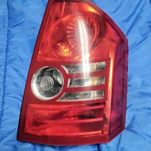 OEM 2007-2012 Dodge Caliber passenger side right tail light assembly front lens view