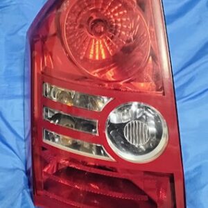 OEM 2007-2012 Dodge Caliber driver side left tail light assembly front lens view