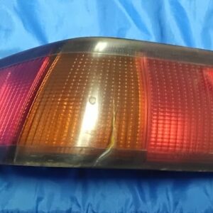 OEM 1987-1991 Toyota Camry Sedan passenger side right outer tail light assembly front lens view