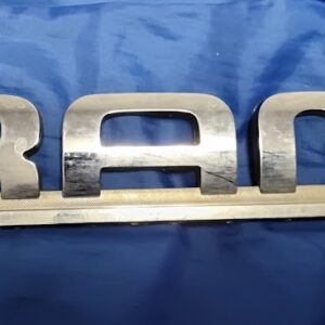 Front view of 2002-2008 Dodge Ram OEM chrome RAM door emblem badge